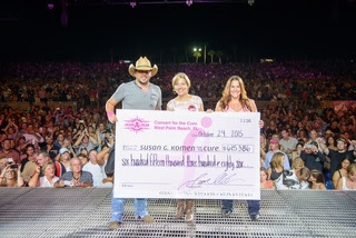 Jason Aldean presenting a check to Susan G. Komen Foundation representatives
