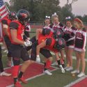 High School Football Team Supports Cheerleader with Cancer