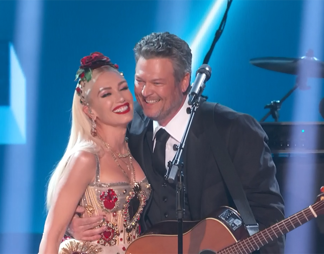 Gwen Stefani and Blake Shelton on stage at the Grammy Awards