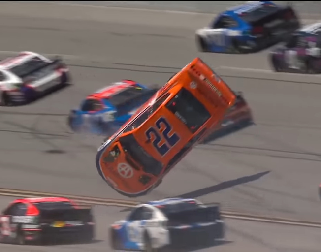 Number 22 NASCAR Cup Series car driven by Joey Logano in the air at Talladega Super Speedway 04-25-21