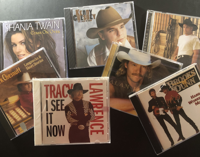 90s CDs by Shania Twain, Kenny Chesney, Garth Brooks, Mark Chesnutt, Tracy Lawrence, Alan Jackson and Brooks & Dunn