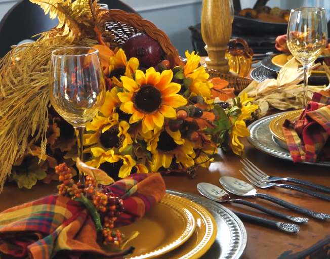 A table decorated for Thanksgiving dinner