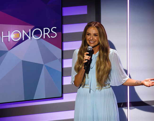 Carly Pearce on stage as host of 'ACM Honors'
