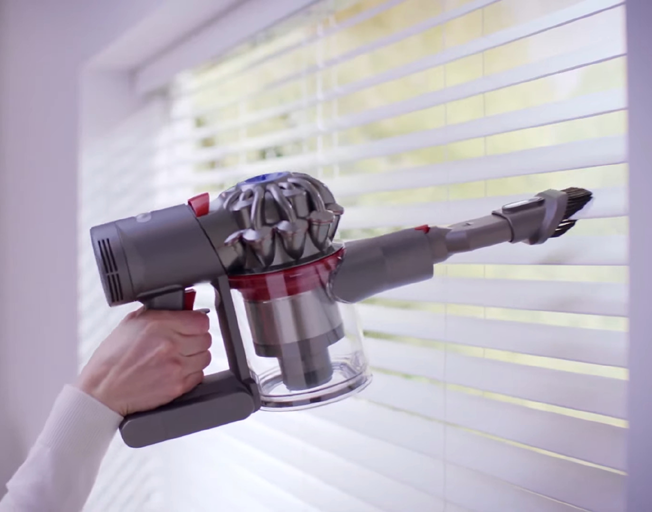 Hand-held portable vacuum