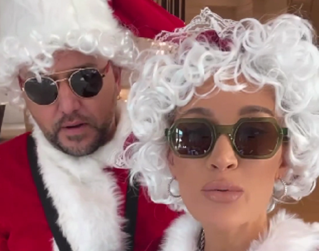 Jason and Brittany Aldean dressed as Santa and Mrs. Claus