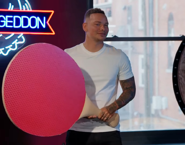 Kane Brown with a giant paddle on 'Barmageddon'