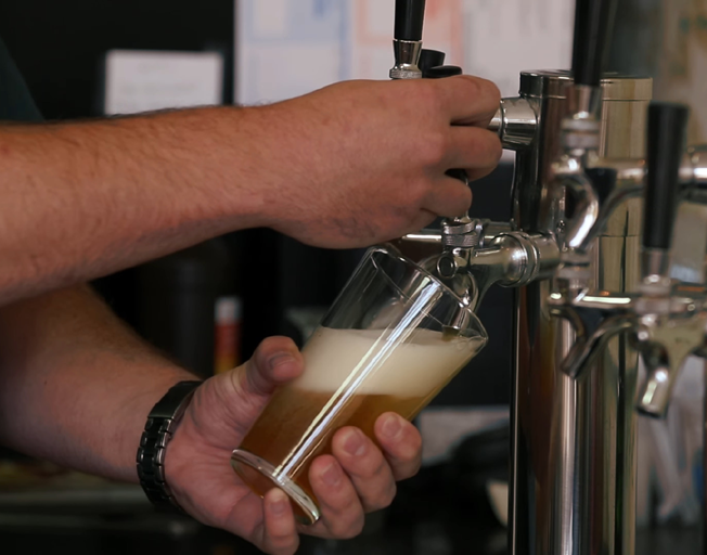 A draft beer being poured
