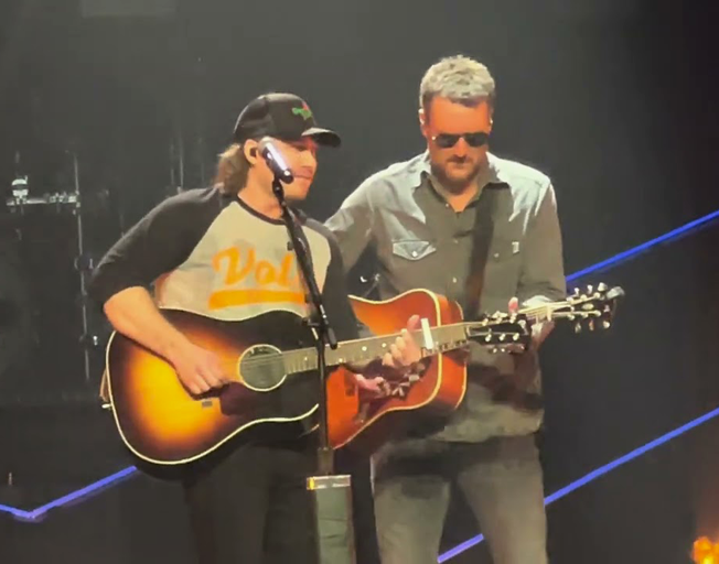 Morgan Wallen and Eric Church performing on stage