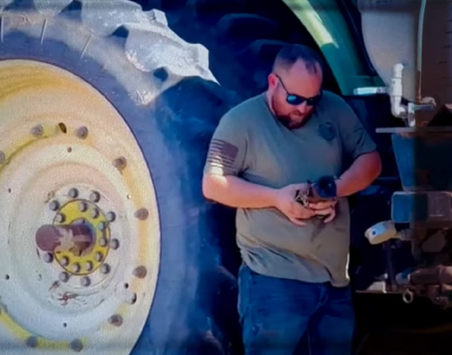 A man working on a tractor