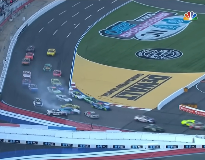 NASCAR Cup cars racing and wrecking in the 2022 Bank of America ROVAL 400