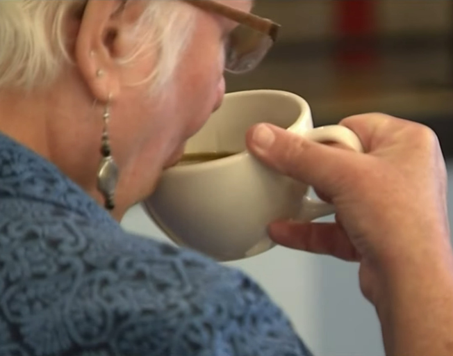 A woman drinking coffee