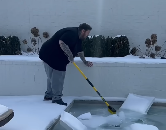 Jelly Roll by his frozen pool