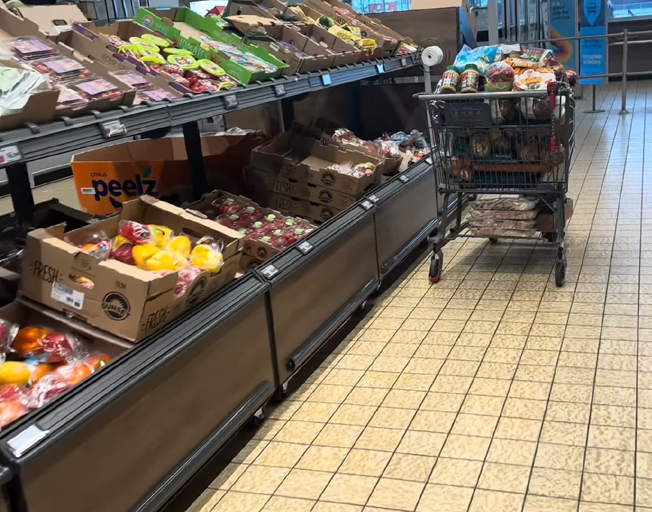 A full shopping cart at a grocery store